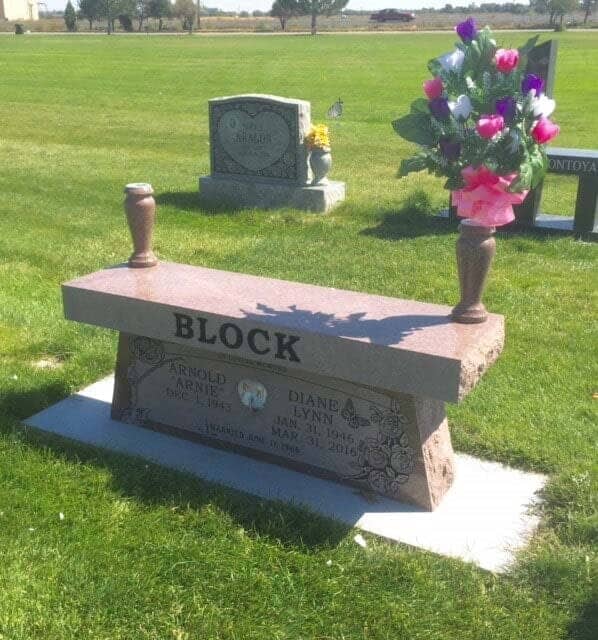 Mahogany granite memorial bench with matching vases and a porcelain portrait