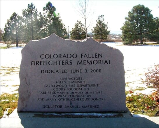 The Colorado Fallen Firefighters Memorial, a large natural faced stone carved with the dedication and the names of its benefactors