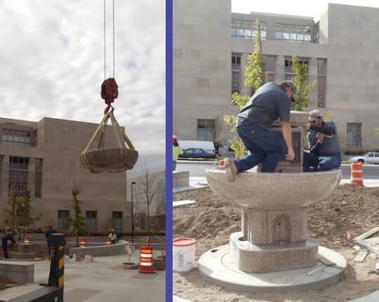 A granite fountain bowl being craned into position, and the same fountain being set by two men